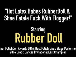 Grand Latex Babes RubberDoll & Shae Fatale Fuck with Flogger!